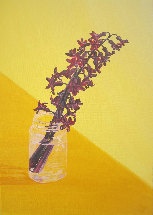 Two Purple Hyacinths In A Glass Jar