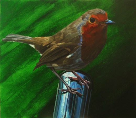 Robin on a wheelbarrow handle